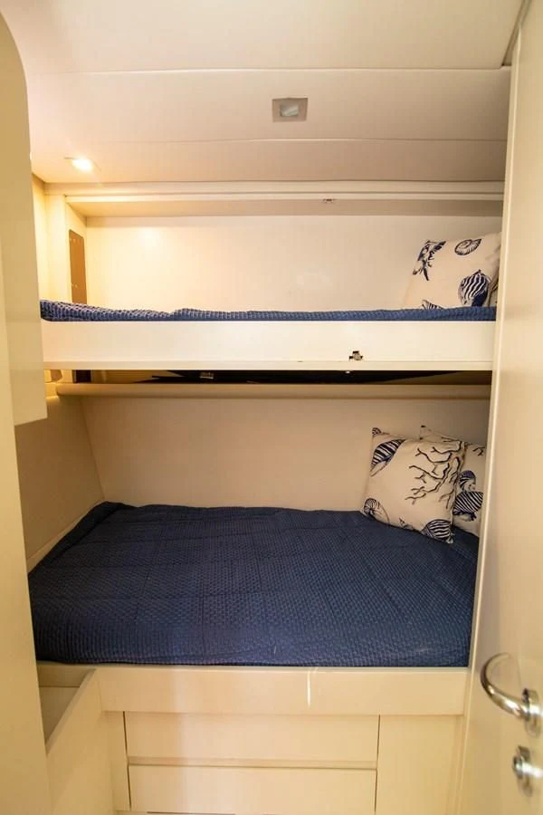 a white shelf with a blue blanket aboard UPTOWN GIRL Yacht for Sale