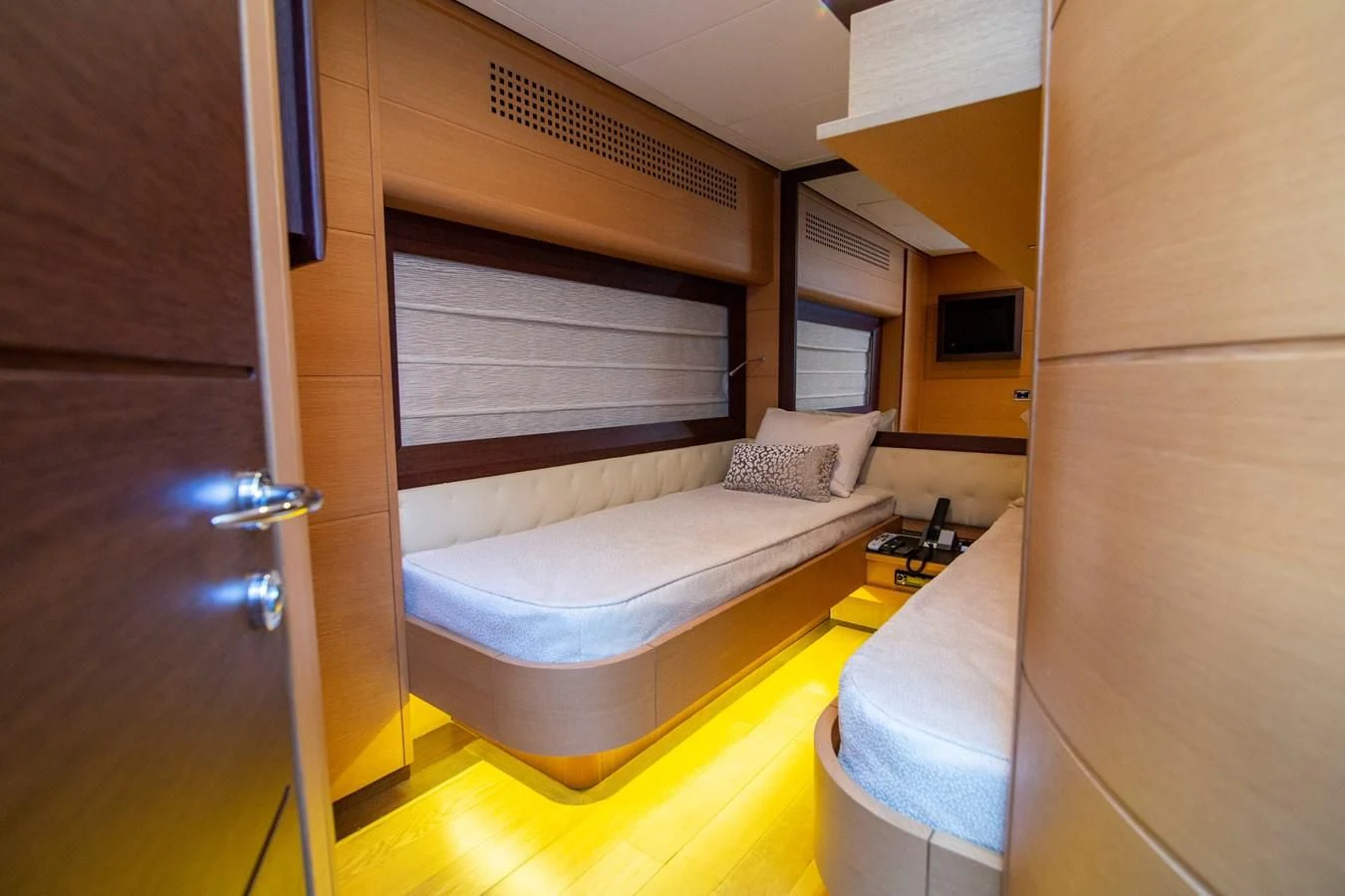 a room with a bed and a closet aboard UPTOWN GIRL Yacht for Sale