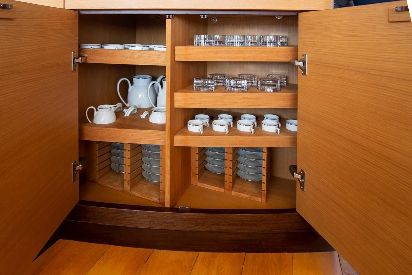 a wooden cabinet with a coffee maker aboard UPTOWN GIRL Yacht for Sale