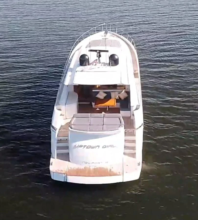 a white ship on the water aboard UPTOWN GIRL Yacht for Sale