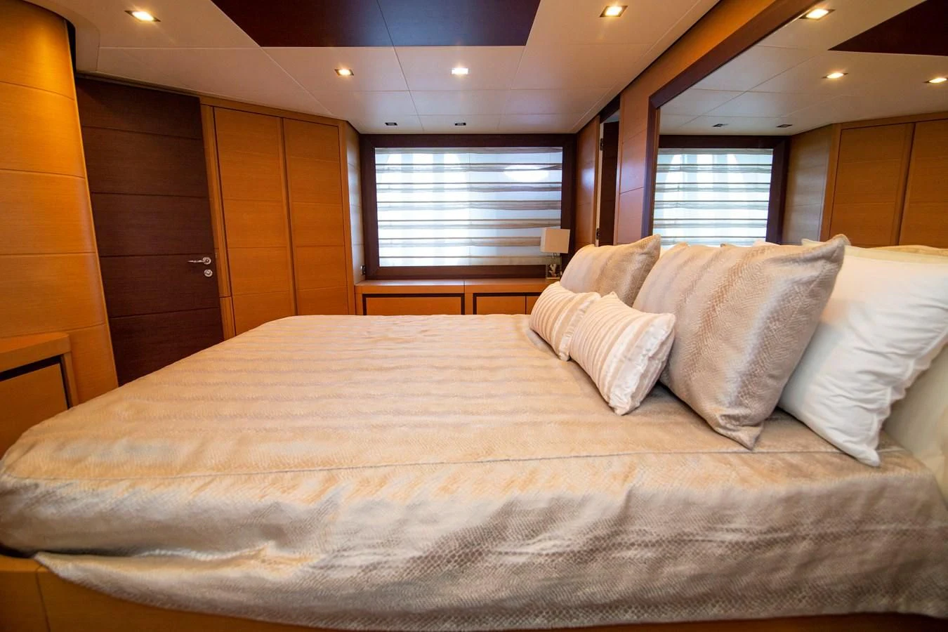 a bed with white pillows aboard UPTOWN GIRL Yacht for Sale