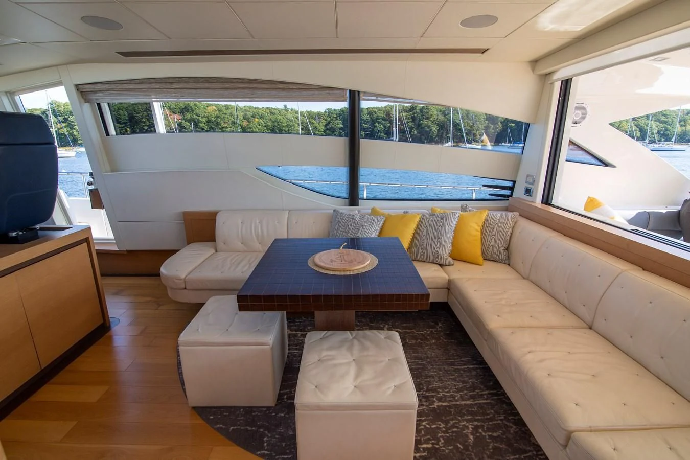 a living room with a couch and a table aboard UPTOWN GIRL Yacht for Sale