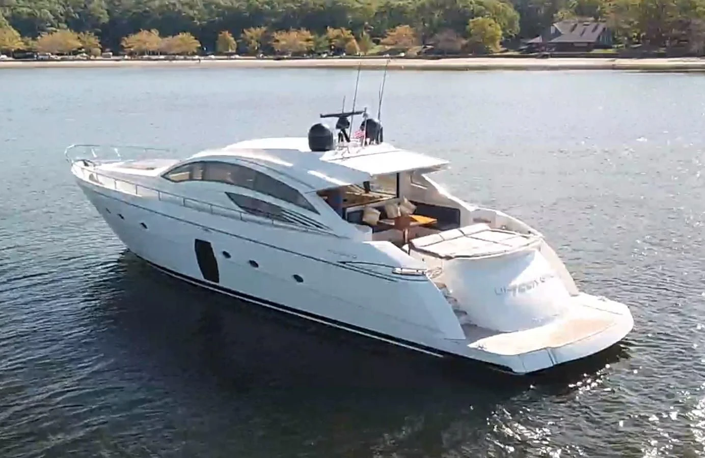 a white yacht on the water aboard UPTOWN GIRL Yacht for Sale