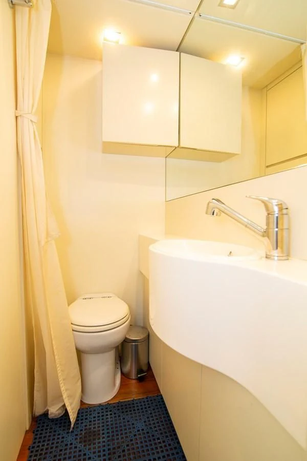 a bathroom with a sink toilet and a bathtub aboard UPTOWN GIRL Yacht for Sale