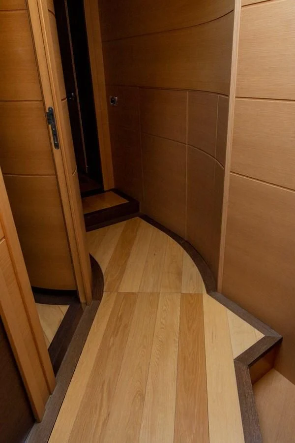 a room with wooden cabinets aboard UPTOWN GIRL Yacht for Sale