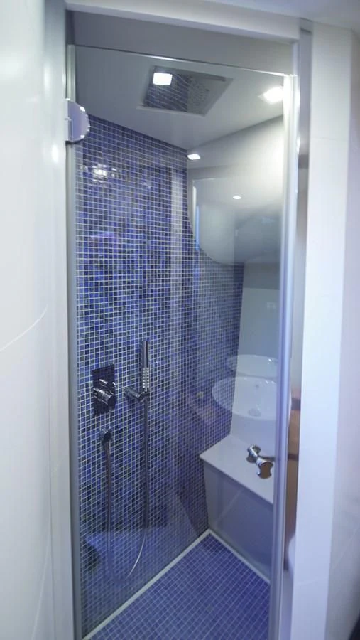 a shower unit with a glass door aboard UPTOWN GIRL Yacht for Sale