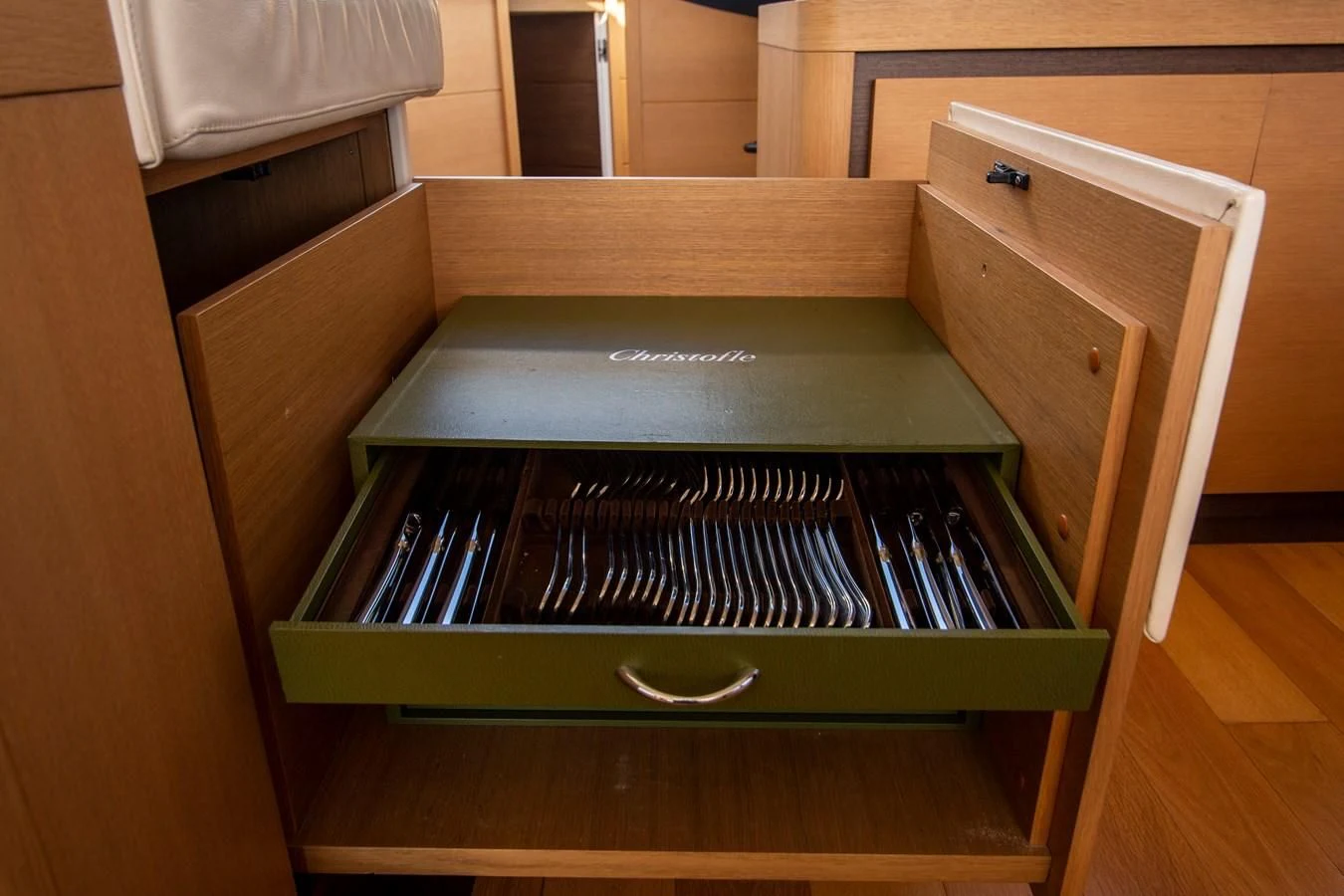 a wood cabinet with a black and white knob aboard UPTOWN GIRL Yacht for Sale