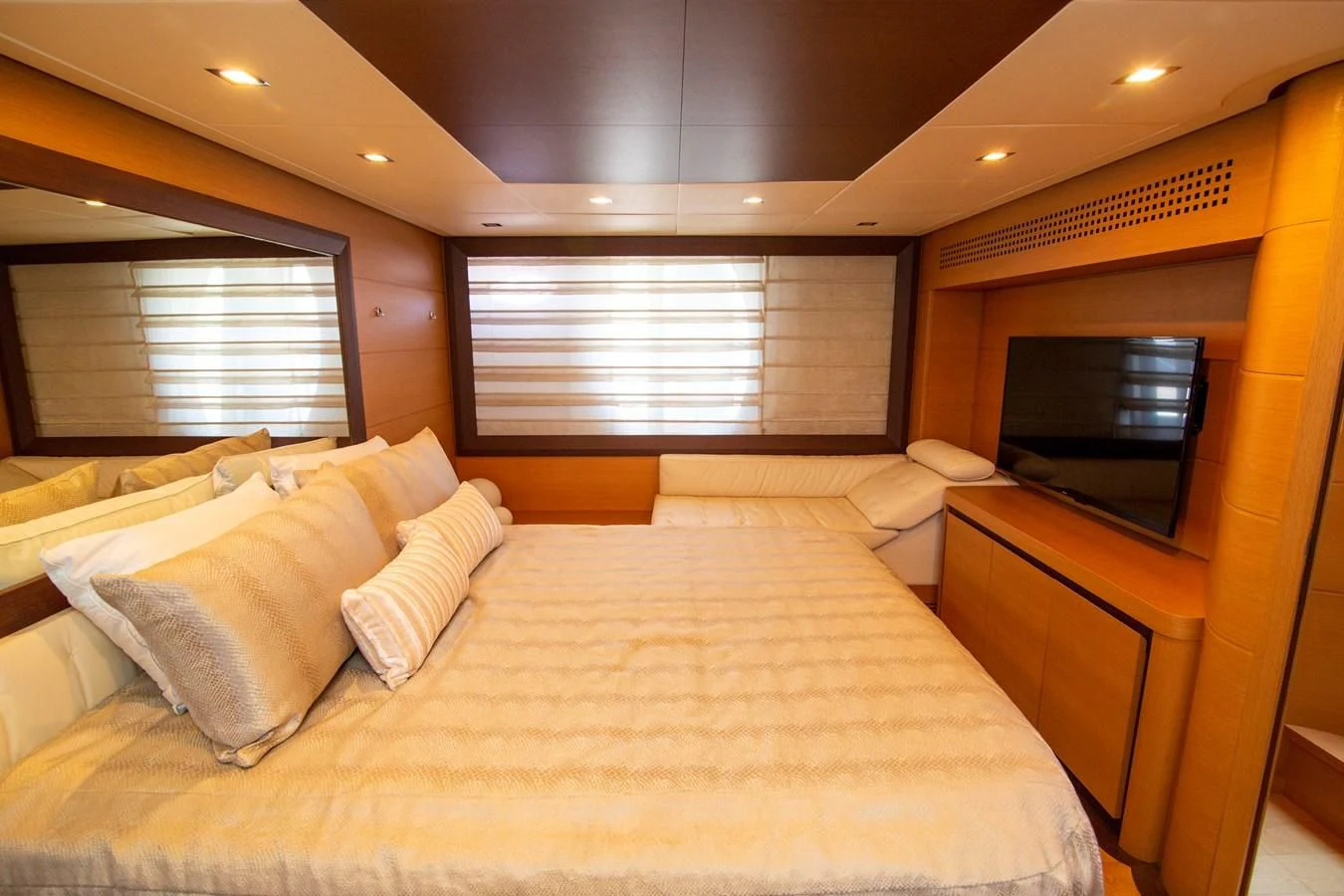 a hotel room with a bed and tv aboard UPTOWN GIRL Yacht for Sale