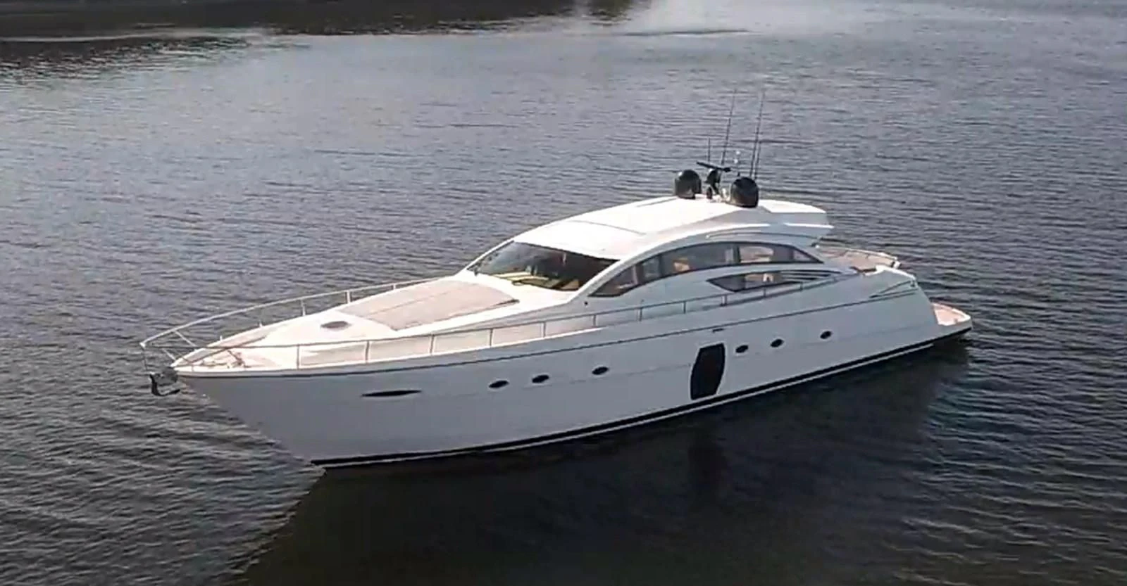 a white yacht on the water aboard UPTOWN GIRL Yacht for Sale