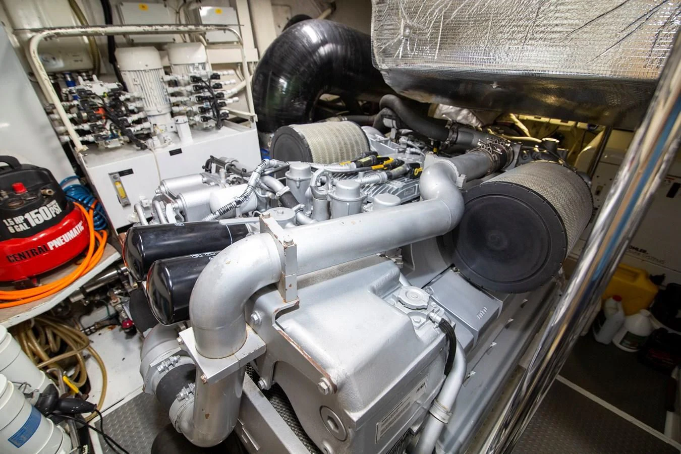 a car engine with a large silver cylinder aboard UPTOWN GIRL Yacht for Sale