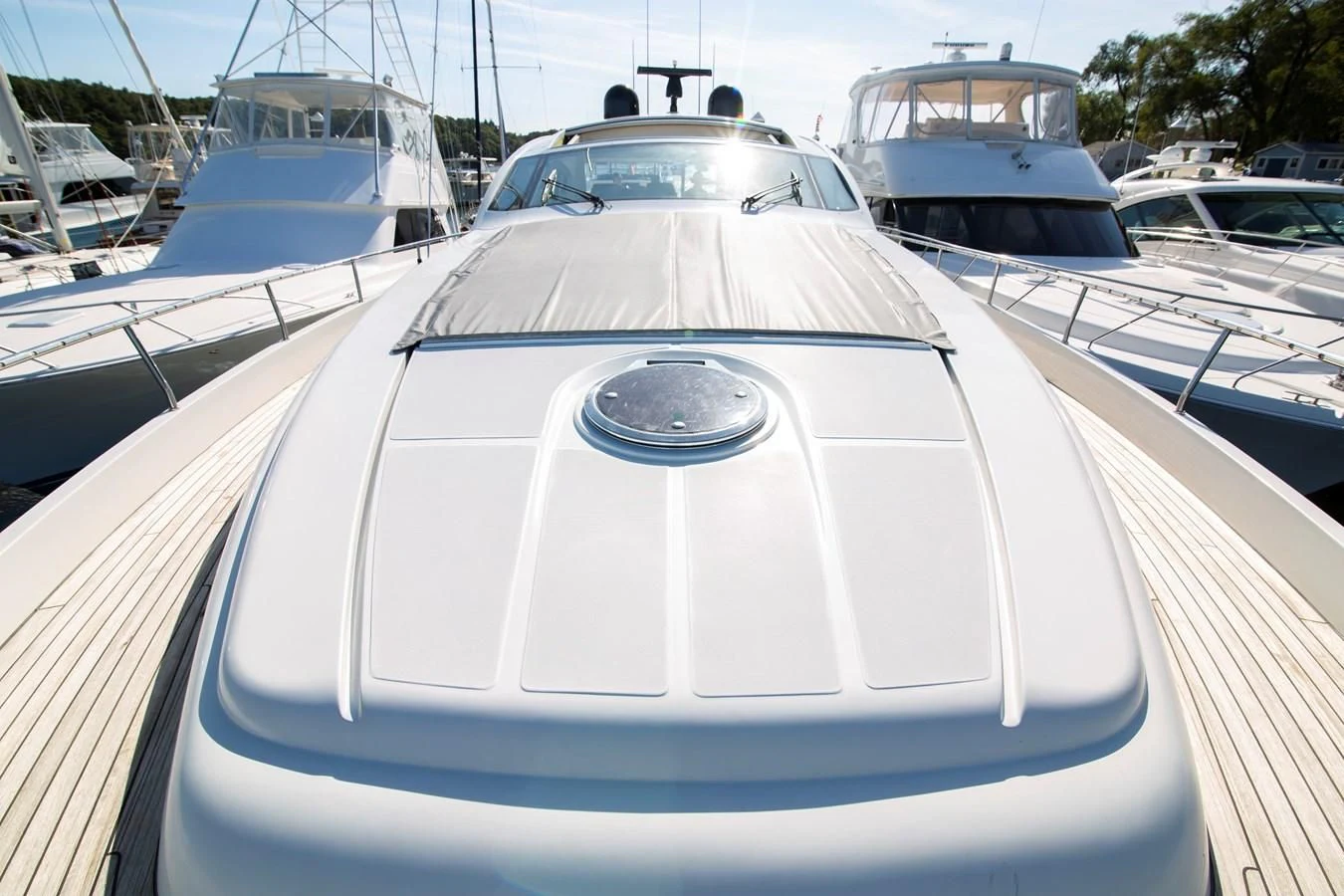 a white car on a boat aboard UPTOWN GIRL Yacht for Sale