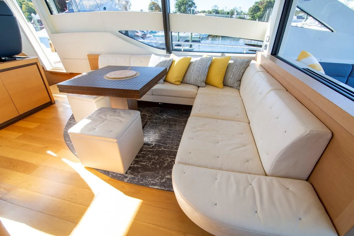 a living room with a couch and a coffee table aboard UPTOWN GIRL Yacht for Sale
