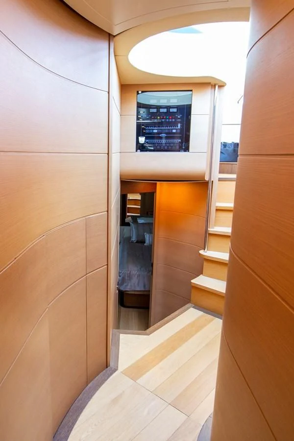 a room with a mirror and a shelf with a chair aboard UPTOWN GIRL Yacht for Sale