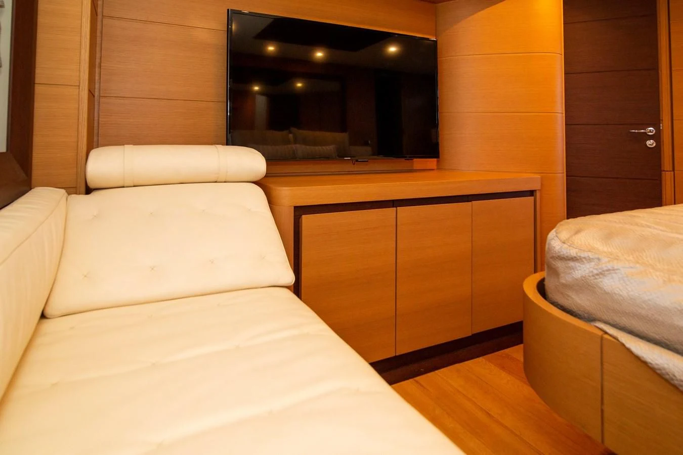 a room with a bed and a dresser aboard UPTOWN GIRL Yacht for Sale