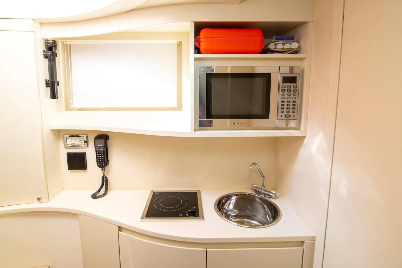 a microwave oven on a white counter aboard UPTOWN GIRL Yacht for Sale