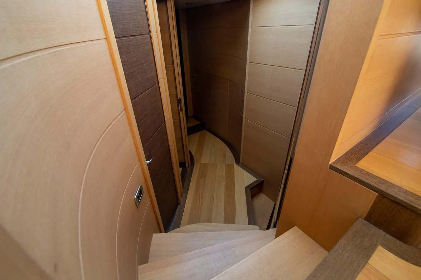 a hallway with a wood door aboard UPTOWN GIRL Yacht for Sale