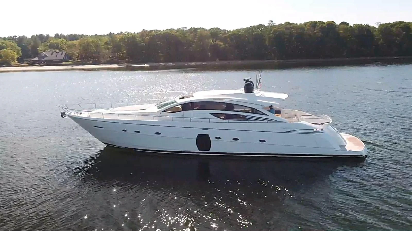 a white boat on water aboard UPTOWN GIRL Yacht for Sale