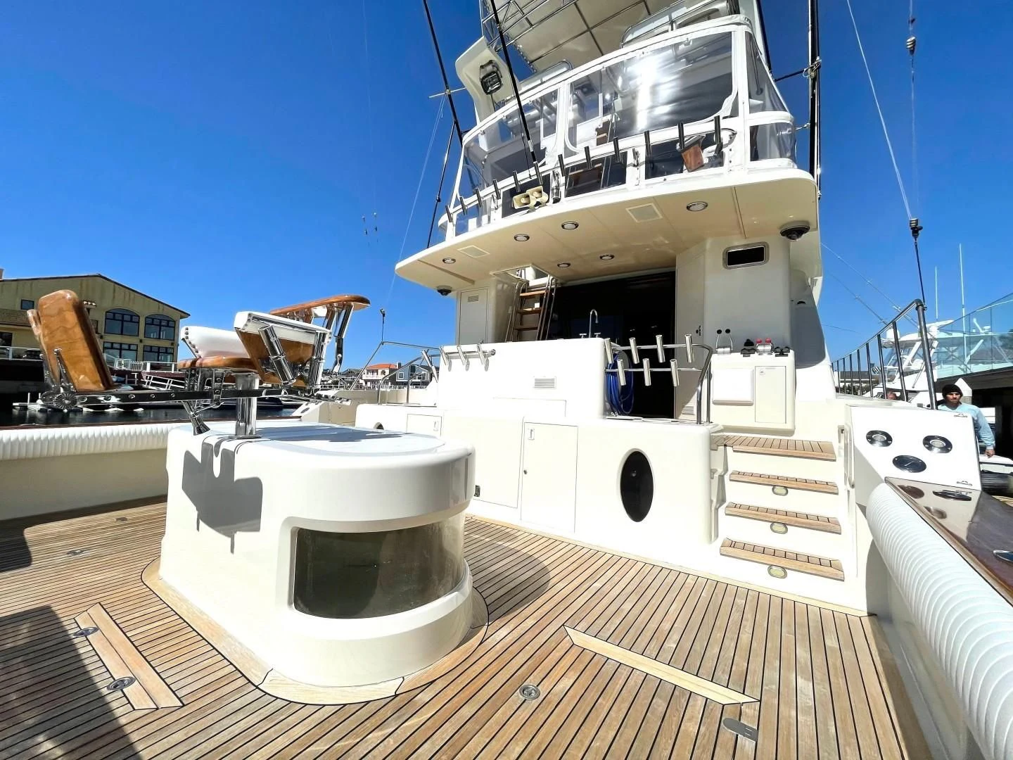 a large white boat on a deck aboard AFTER MIDNIGHT Yacht for Sale