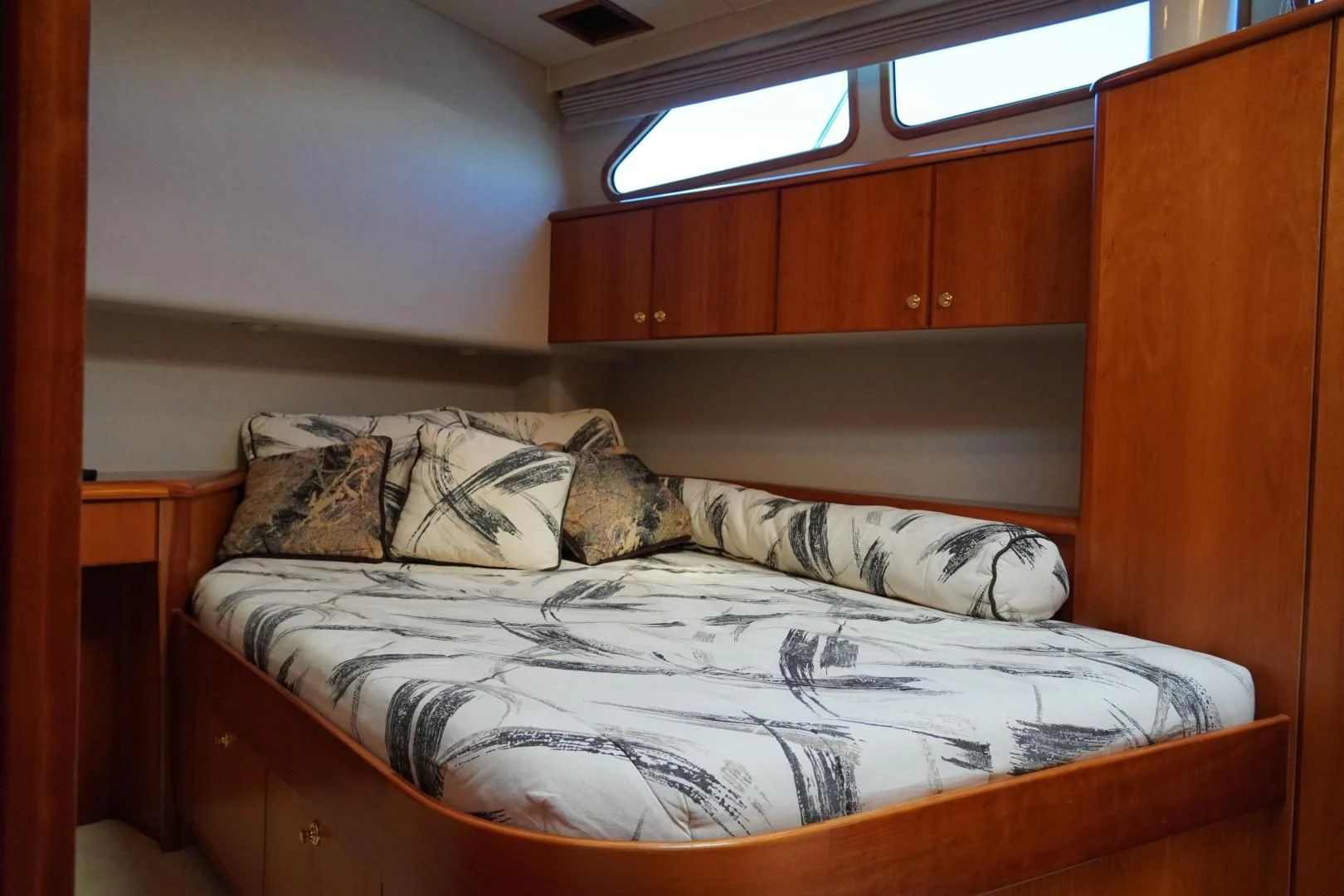 a bed with pillows aboard AFTER MIDNIGHT Yacht for Sale