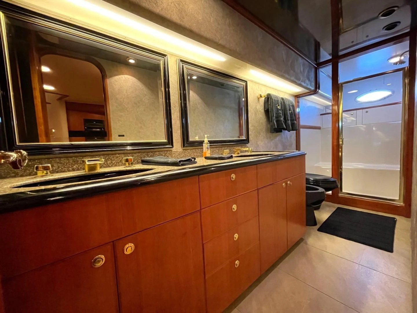 a kitchen with wooden cabinets aboard AFTER MIDNIGHT Yacht for Sale