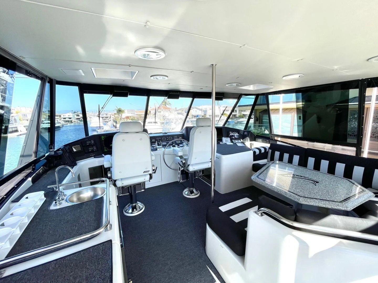 a bus with seats and a bench aboard AFTER MIDNIGHT Yacht for Sale