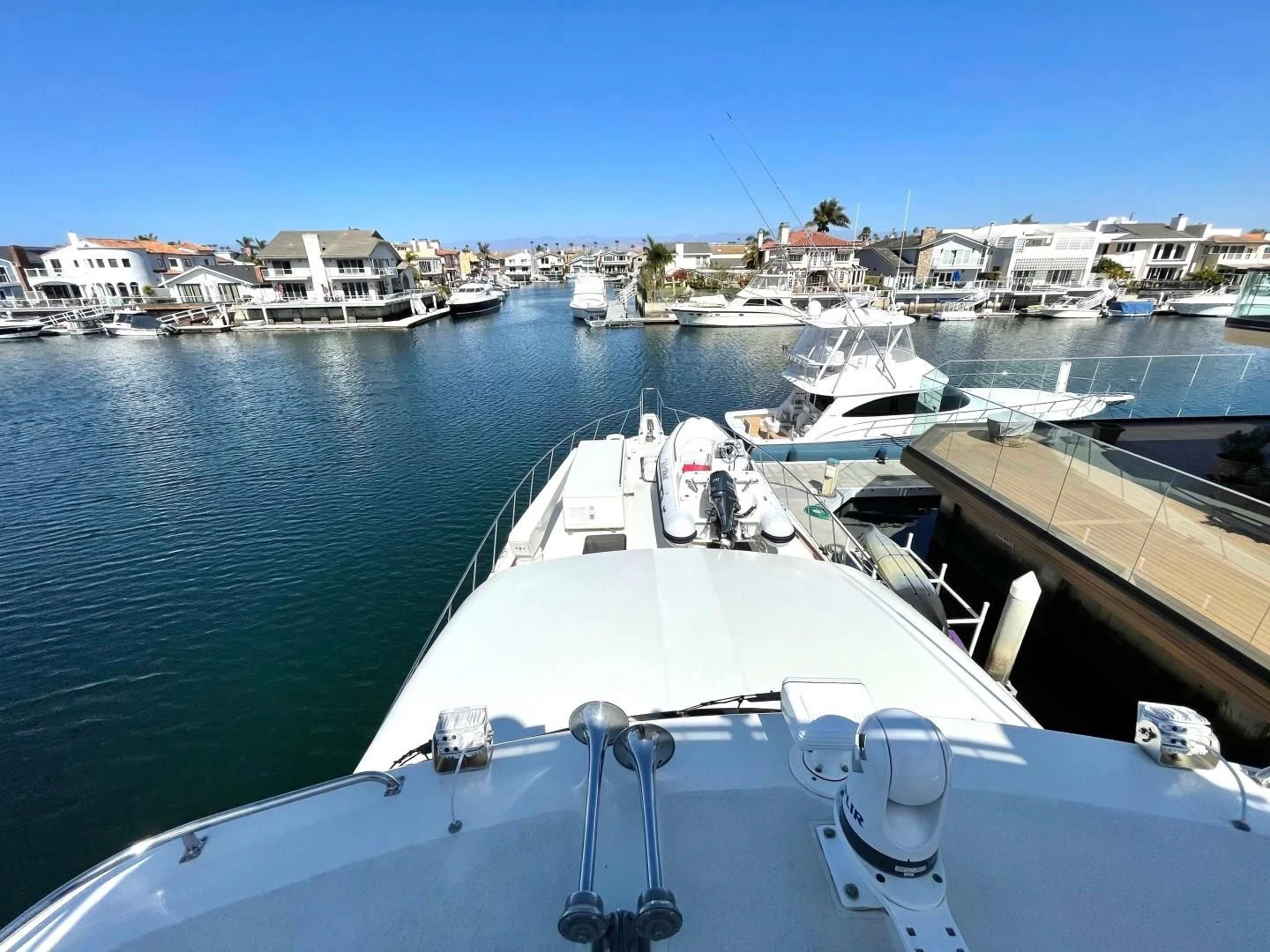a boat dock with boats aboard AFTER MIDNIGHT Yacht for Sale
