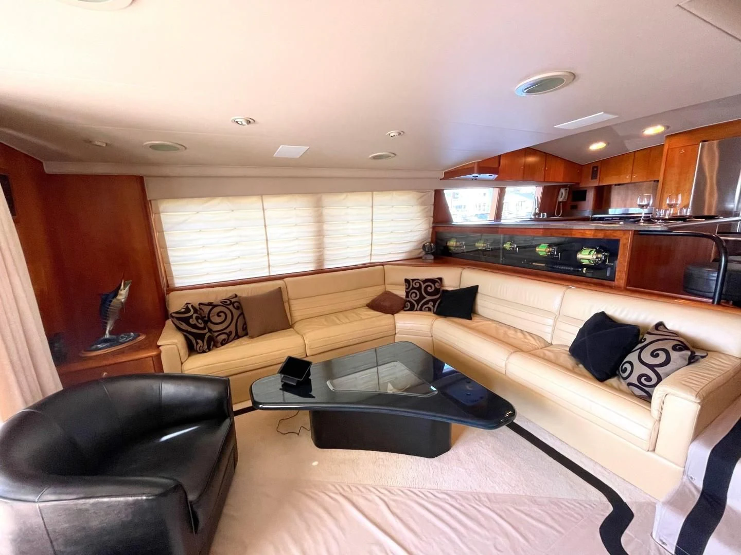 a living room with a couch and a coffee table aboard AFTER MIDNIGHT Yacht for Sale