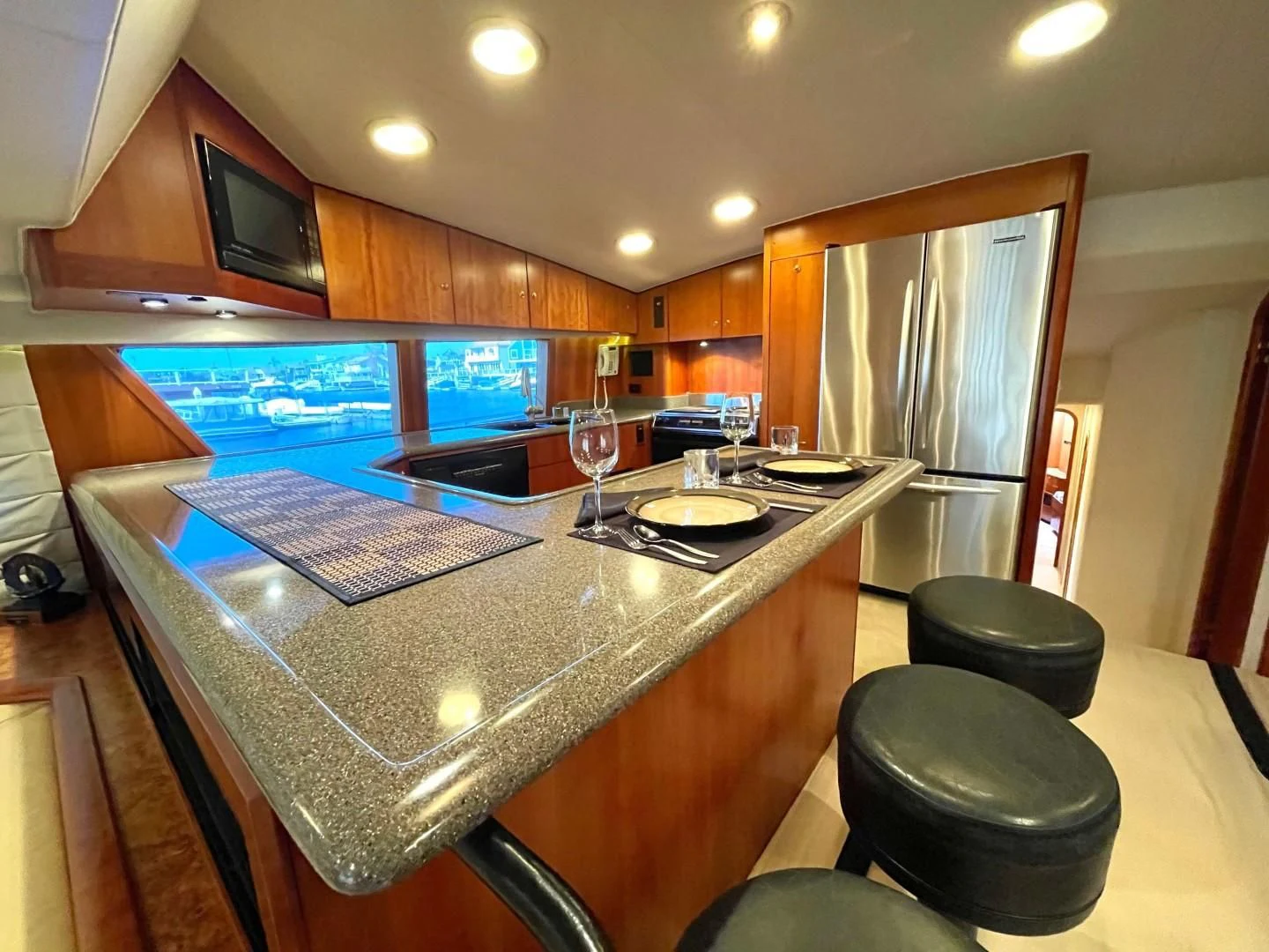 a kitchen with a bar and bar aboard AFTER MIDNIGHT Yacht for Sale