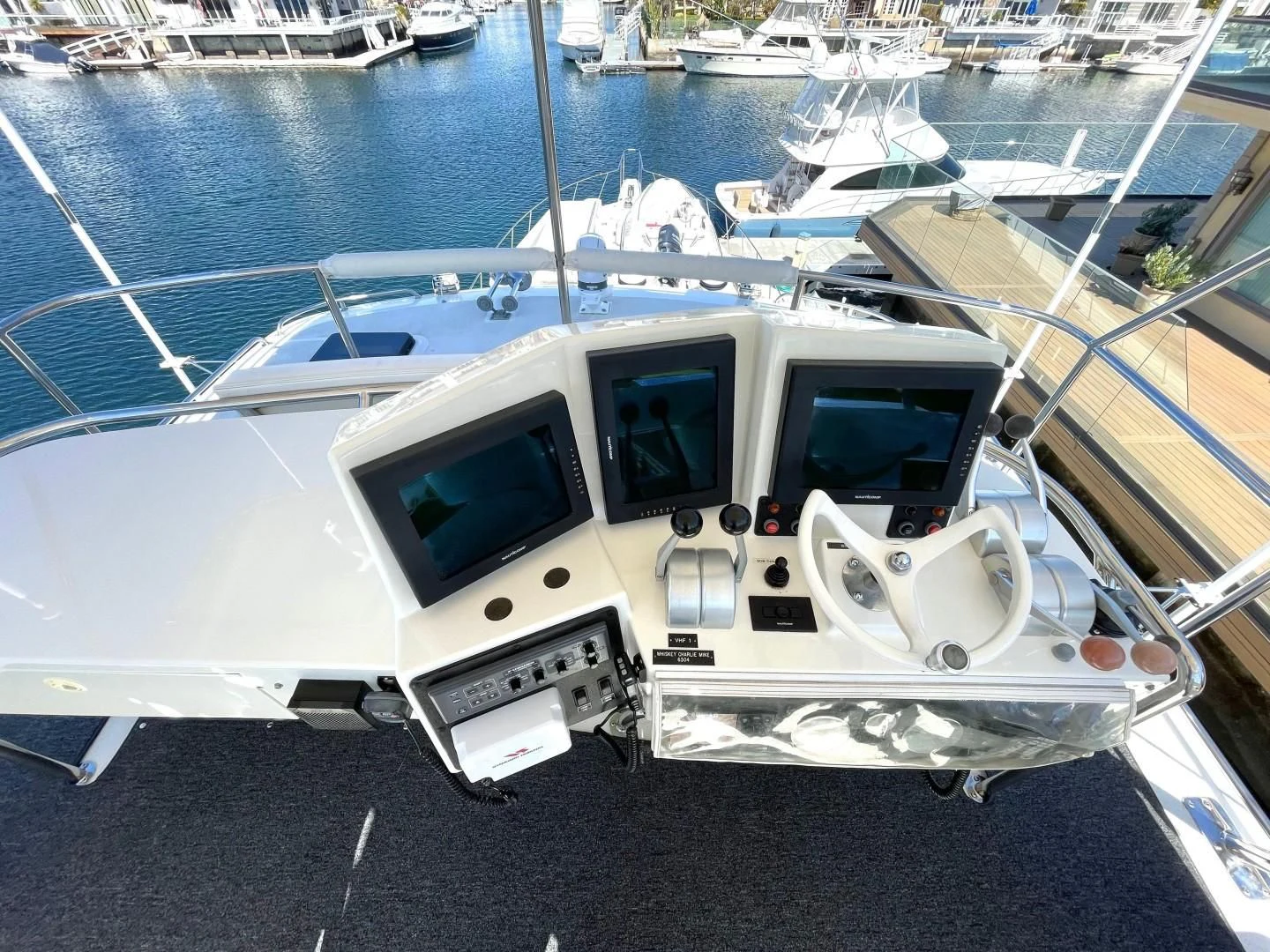 a white boat on the water aboard AFTER MIDNIGHT Yacht for Sale
