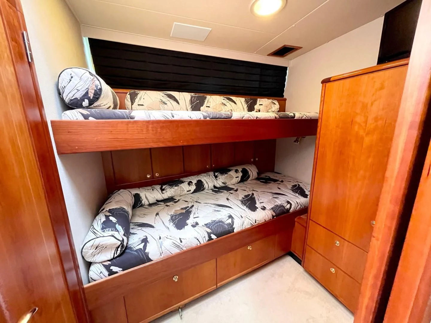 a room with bunk beds aboard AFTER MIDNIGHT Yacht for Sale
