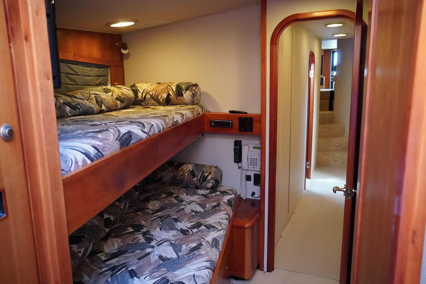 a room with a couple beds aboard AFTER MIDNIGHT Yacht for Sale