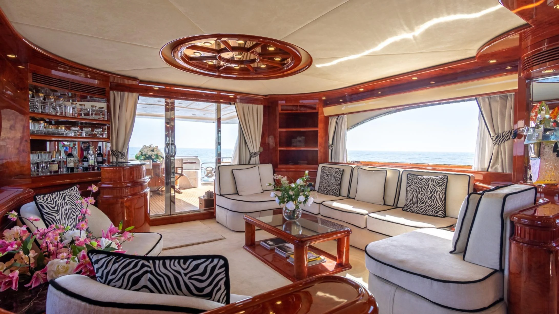 a living room with a large window aboard LADY R Yacht for Sale