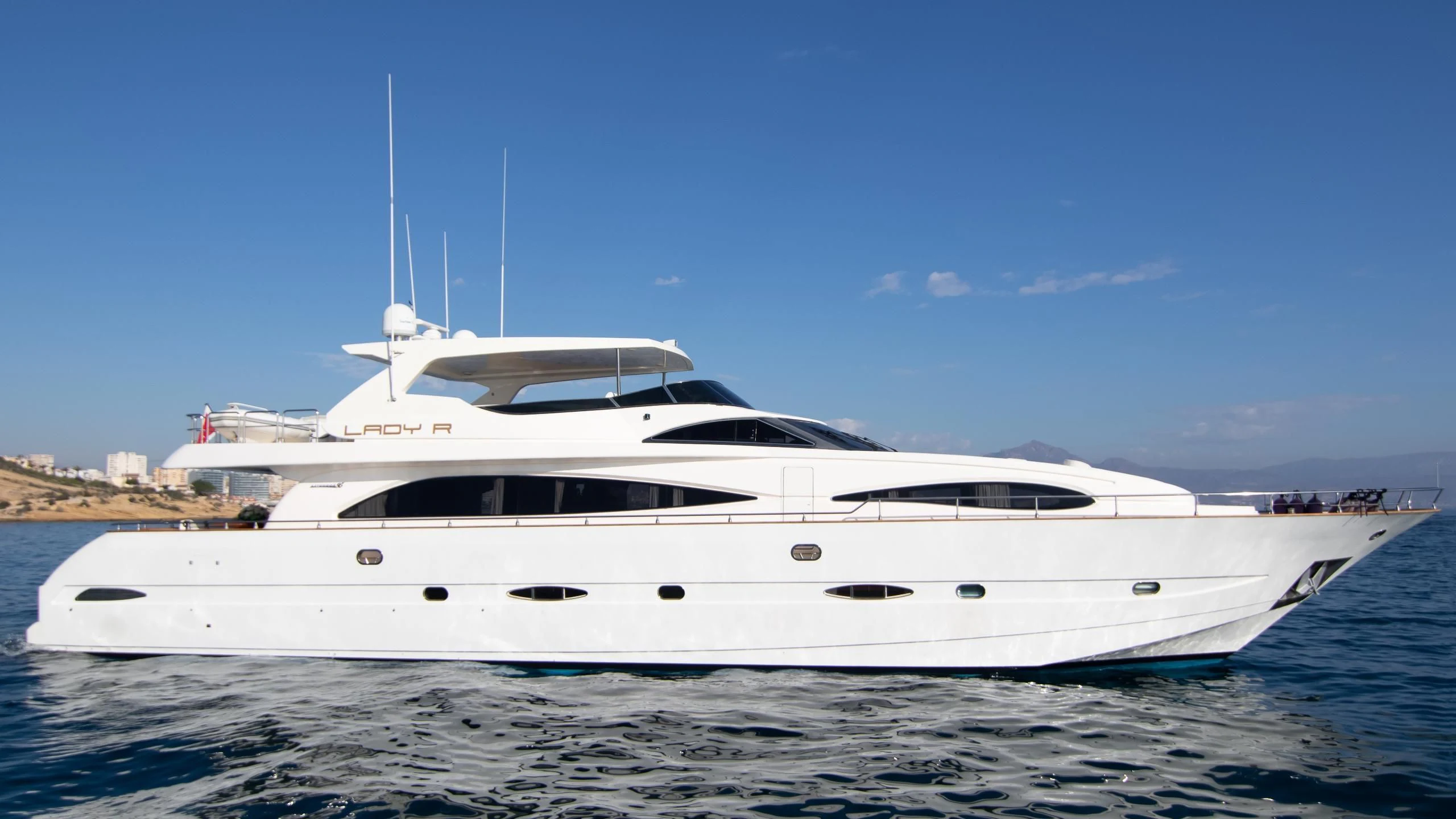 a white yacht on the water aboard LADY R Yacht for Sale