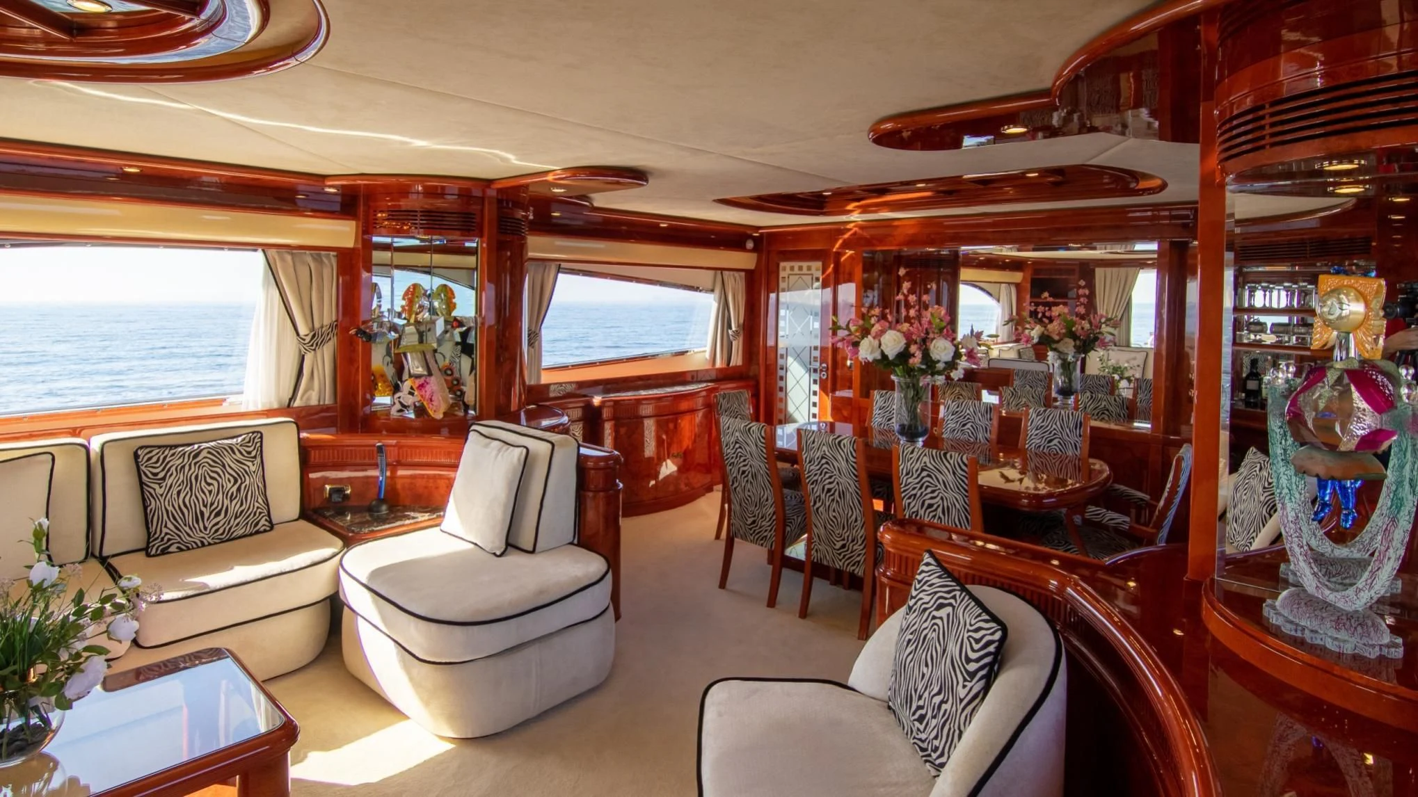 a living room with a large window aboard LADY R Yacht for Sale
