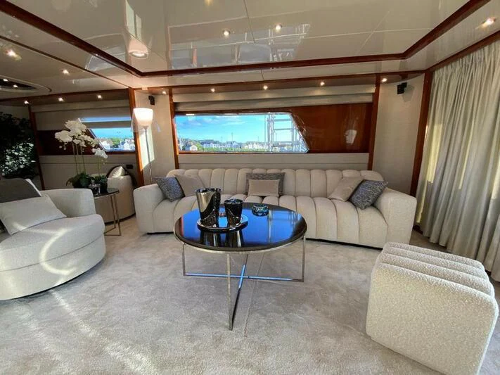 a living room with a large window aboard BY Yacht for Sale
