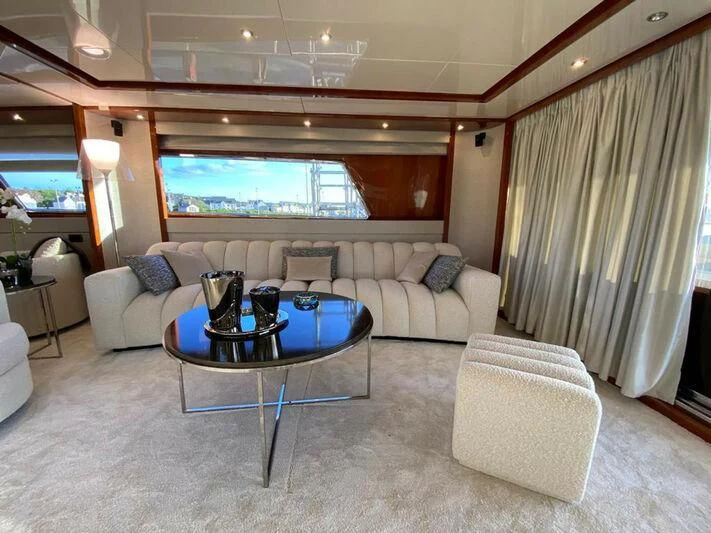 a living room with a large window aboard BY Yacht for Sale