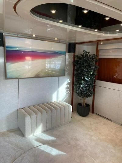 a room with a plant and a couch aboard BY Yacht for Sale