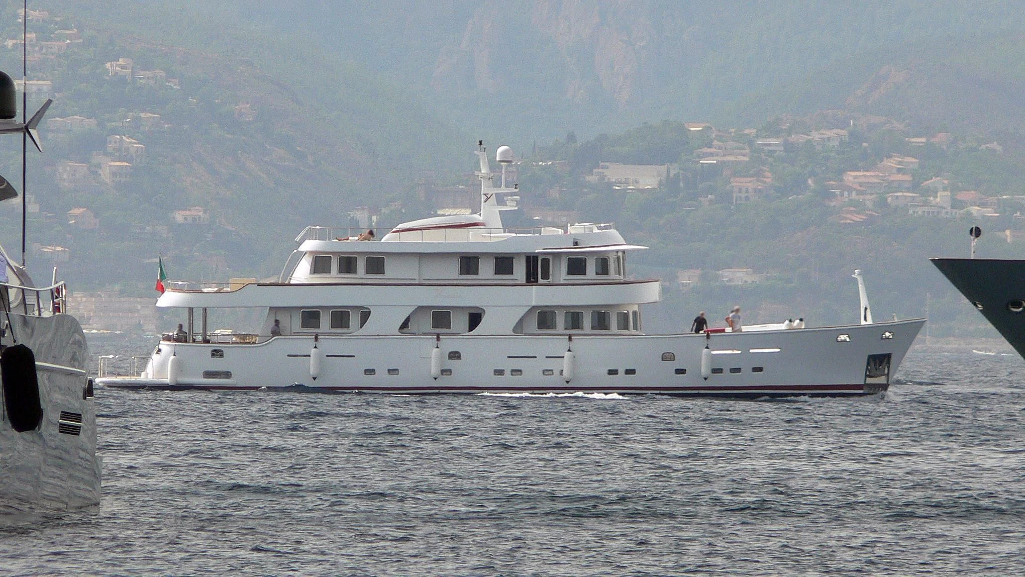 a large white boat in the water aboard TANANAI Yacht for Sale
