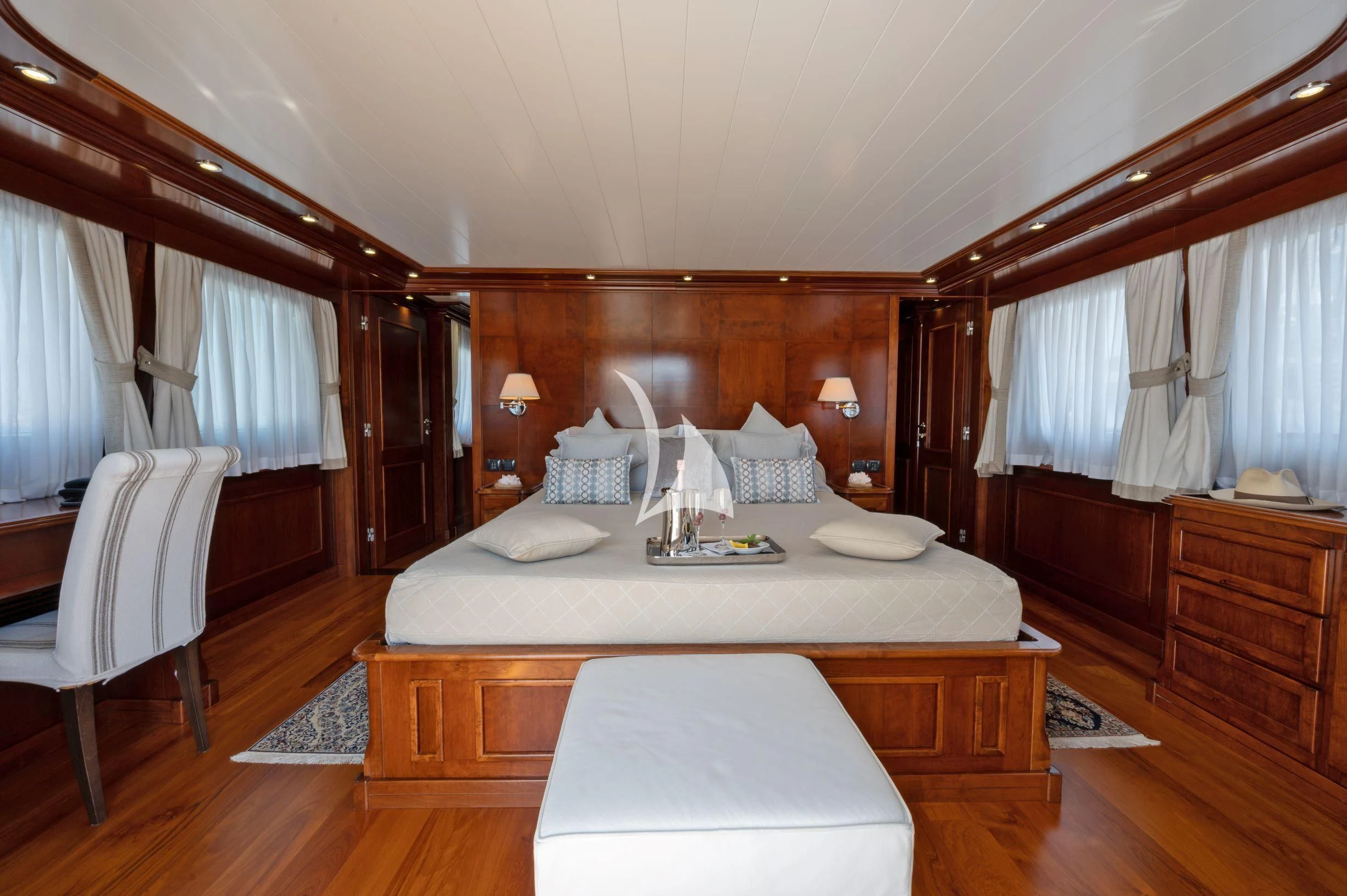 a large bedroom with a large bed aboard TANANAI Yacht for Sale