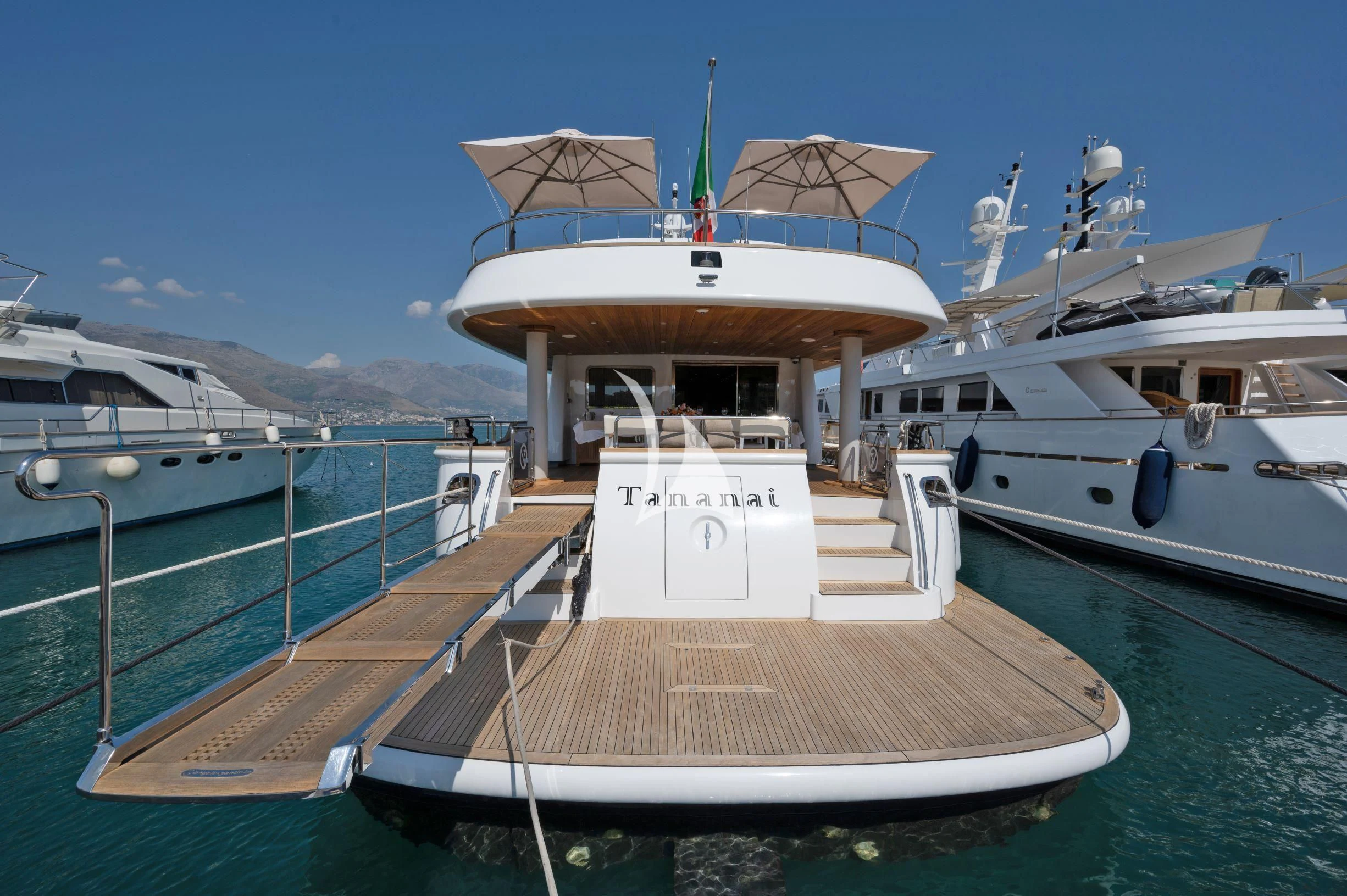 a boat docked at a pier aboard TANANAI Yacht for Sale
