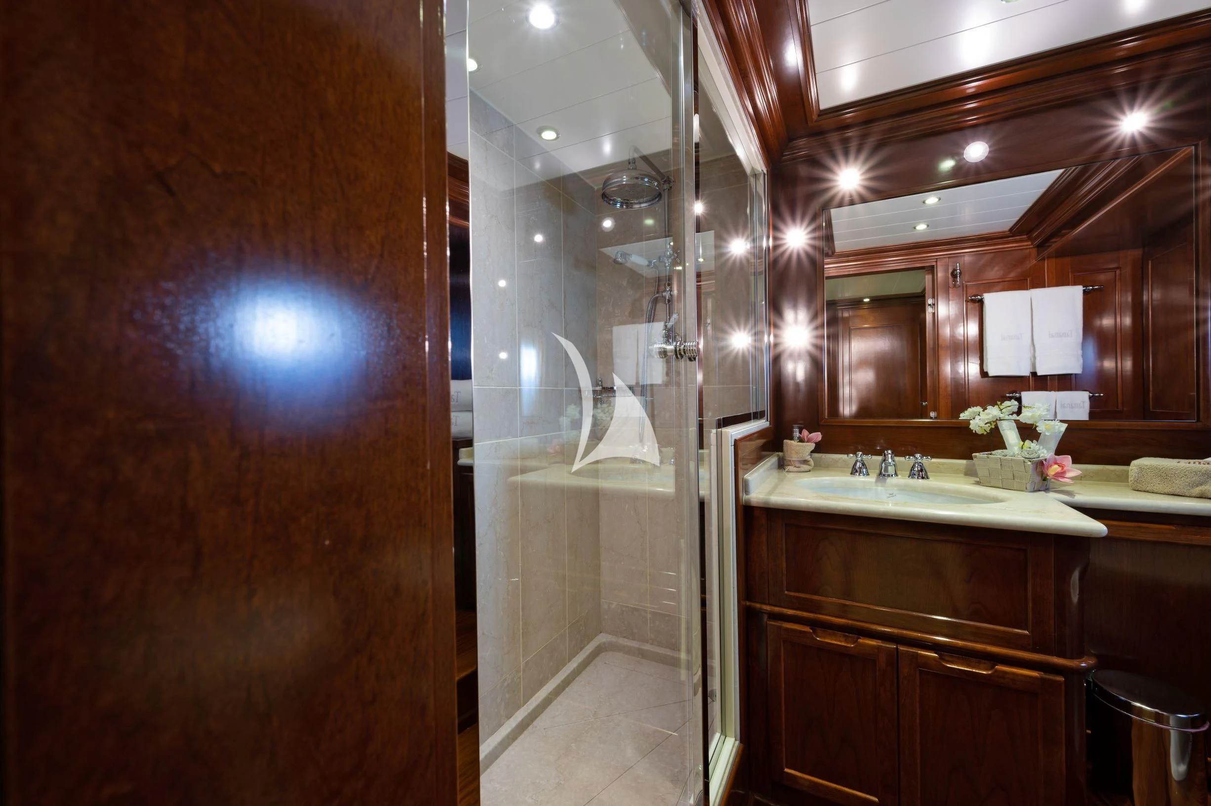 a bathroom with a shower and sink aboard TANANAI Yacht for Sale