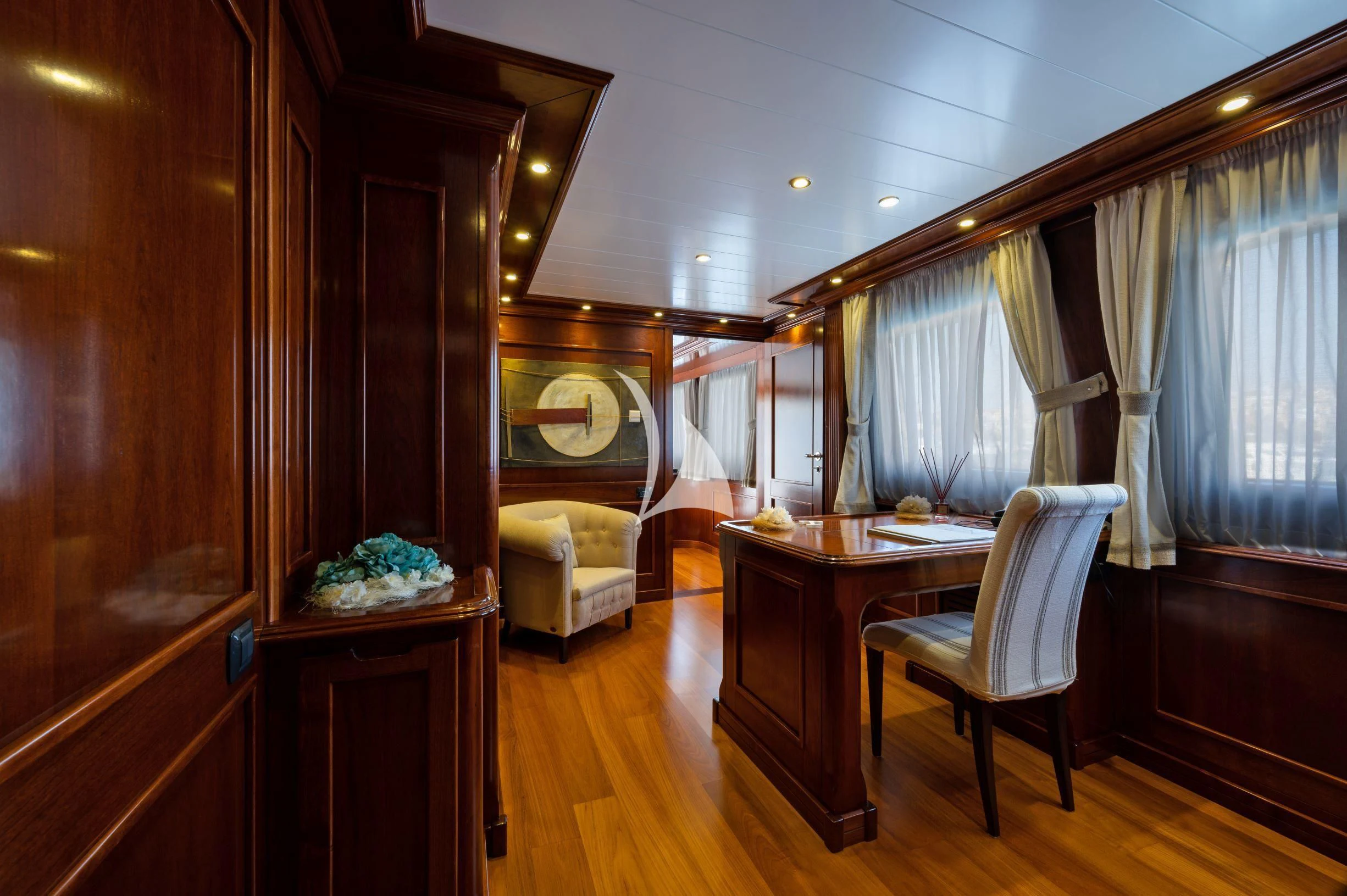 a room with a desk and a chair aboard TANANAI Yacht for Sale