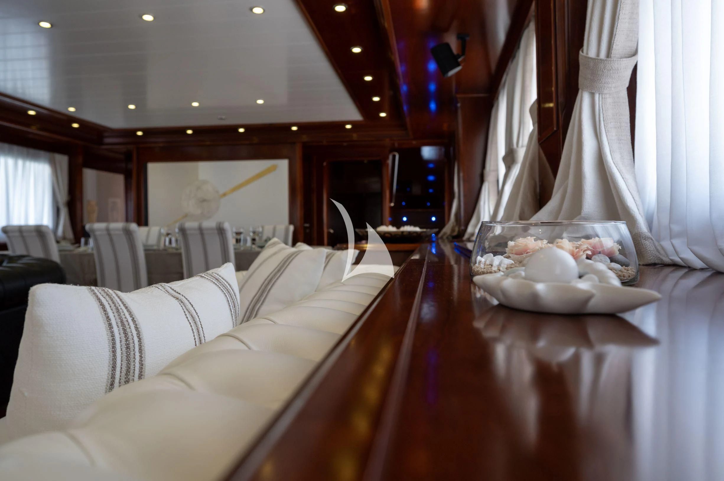 a room with a table and chairs aboard TANANAI Yacht for Sale