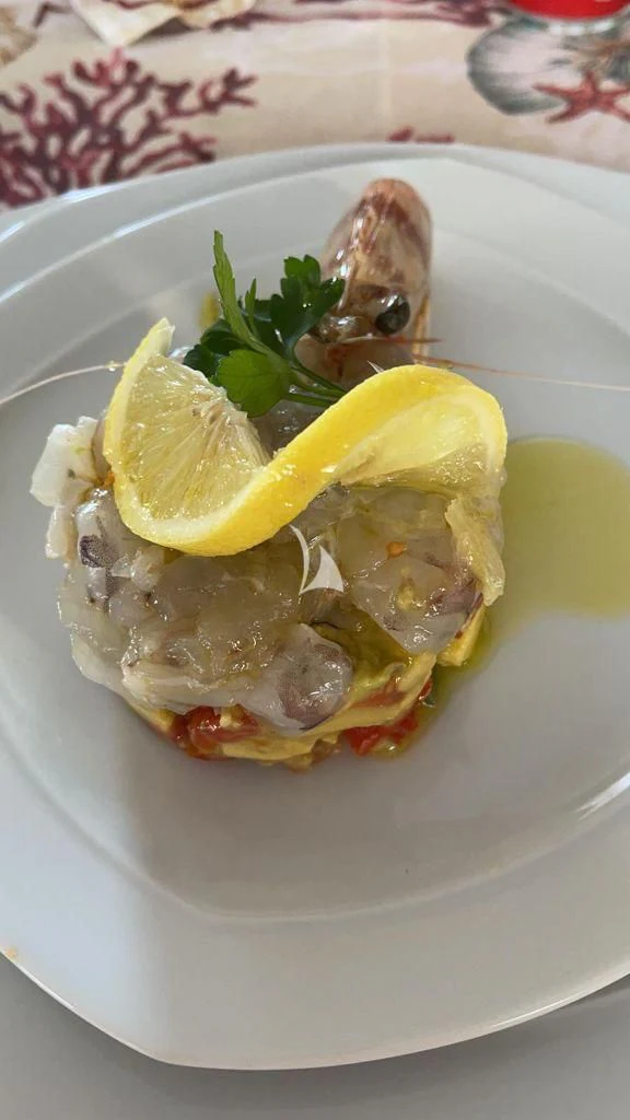 a plate of food aboard TANANAI Yacht for Sale