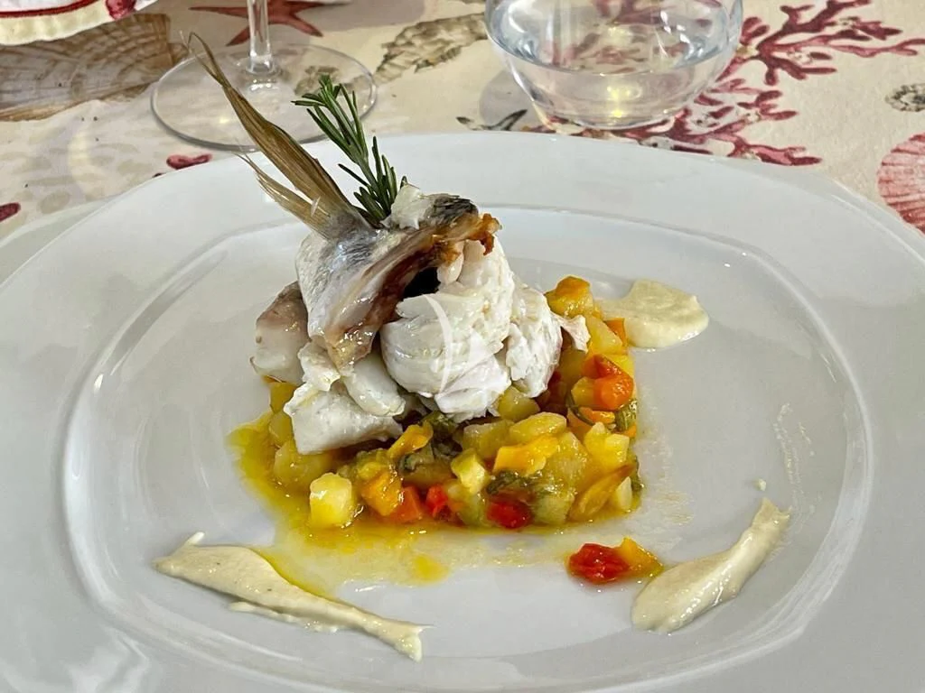 a plate of food aboard TANANAI Yacht for Sale