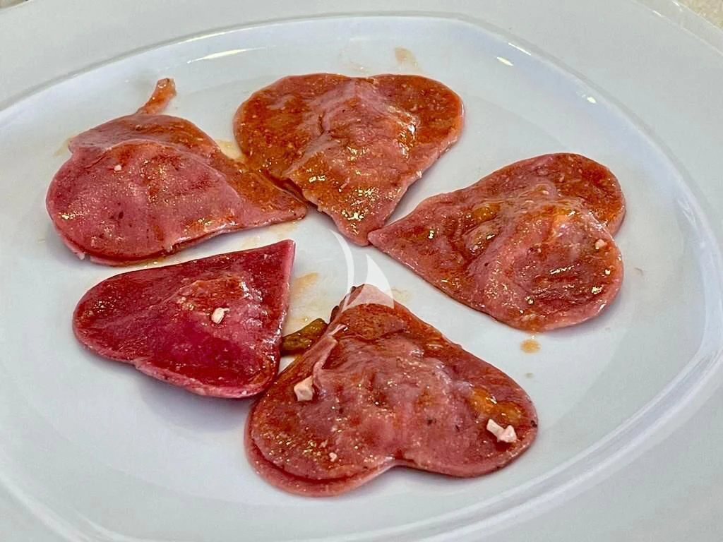 a plate of food aboard TANANAI Yacht for Sale