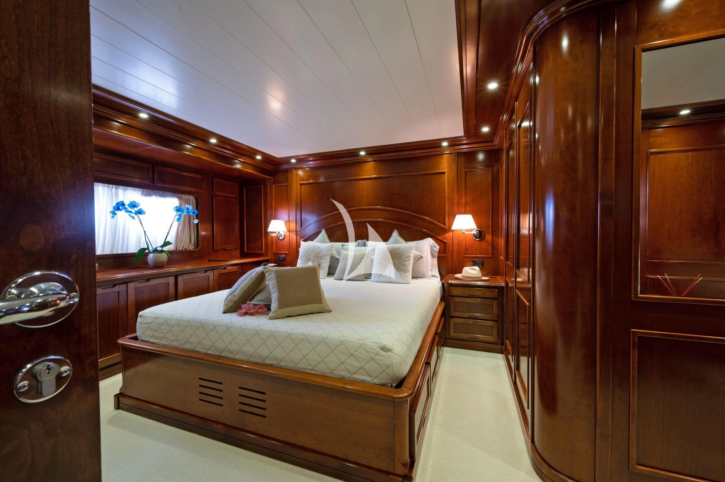a bed in a room aboard TANANAI Yacht for Sale