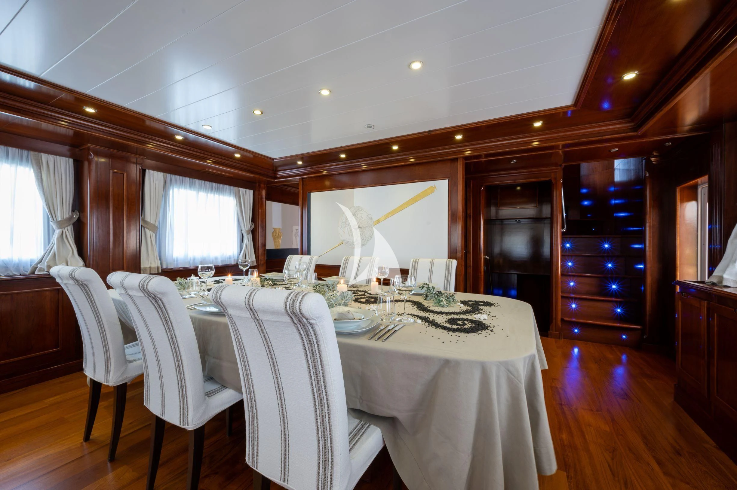a dining table set for a dinner aboard TANANAI Yacht for Sale
