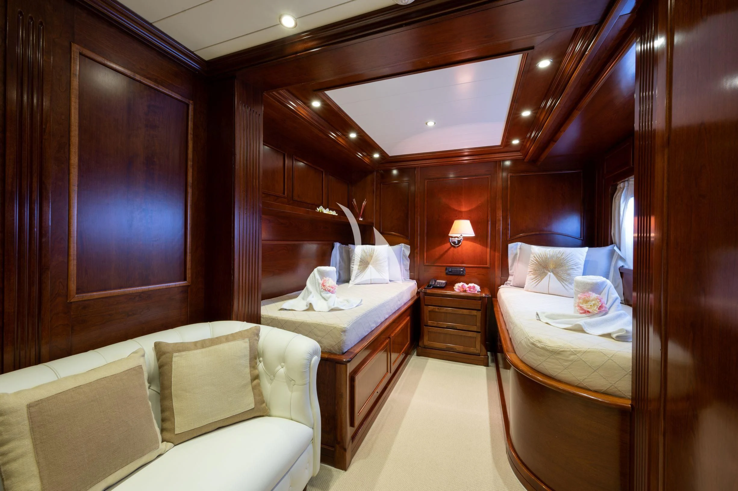 a room with a bed and a desk aboard TANANAI Yacht for Sale