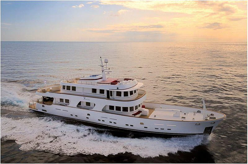 a white yacht in the water aboard TANANAI Yacht for Sale